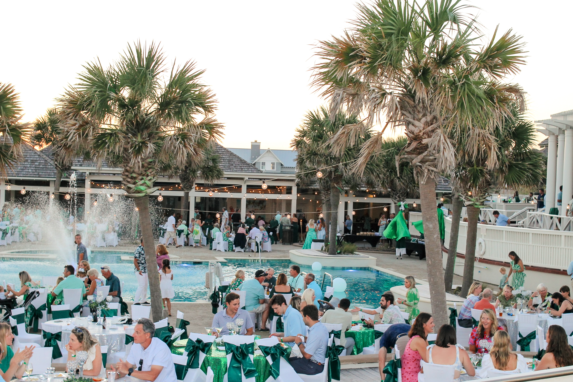 Event members partying at the pool