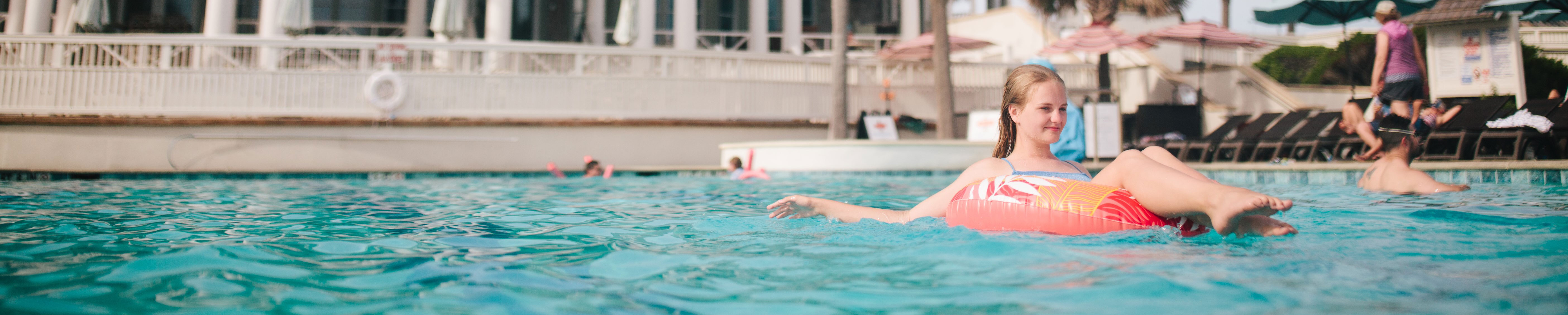 Girl relaxing in Shoals club pool