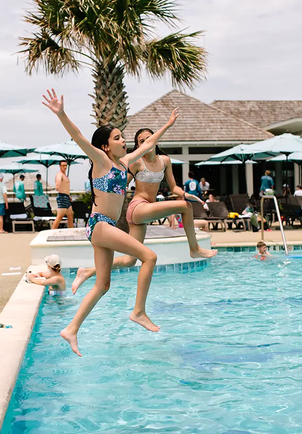 Children enjoying poolside activities